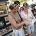 High School friends Pam Wasko, of Farmington Hills, Cheryl Courte, of Novi, and Sue Wilga, of Kansas, look over a map of the art fair as they decide their next move on Thursday, July 18, 2013. Melanie Maxwell | AnnArbor.com